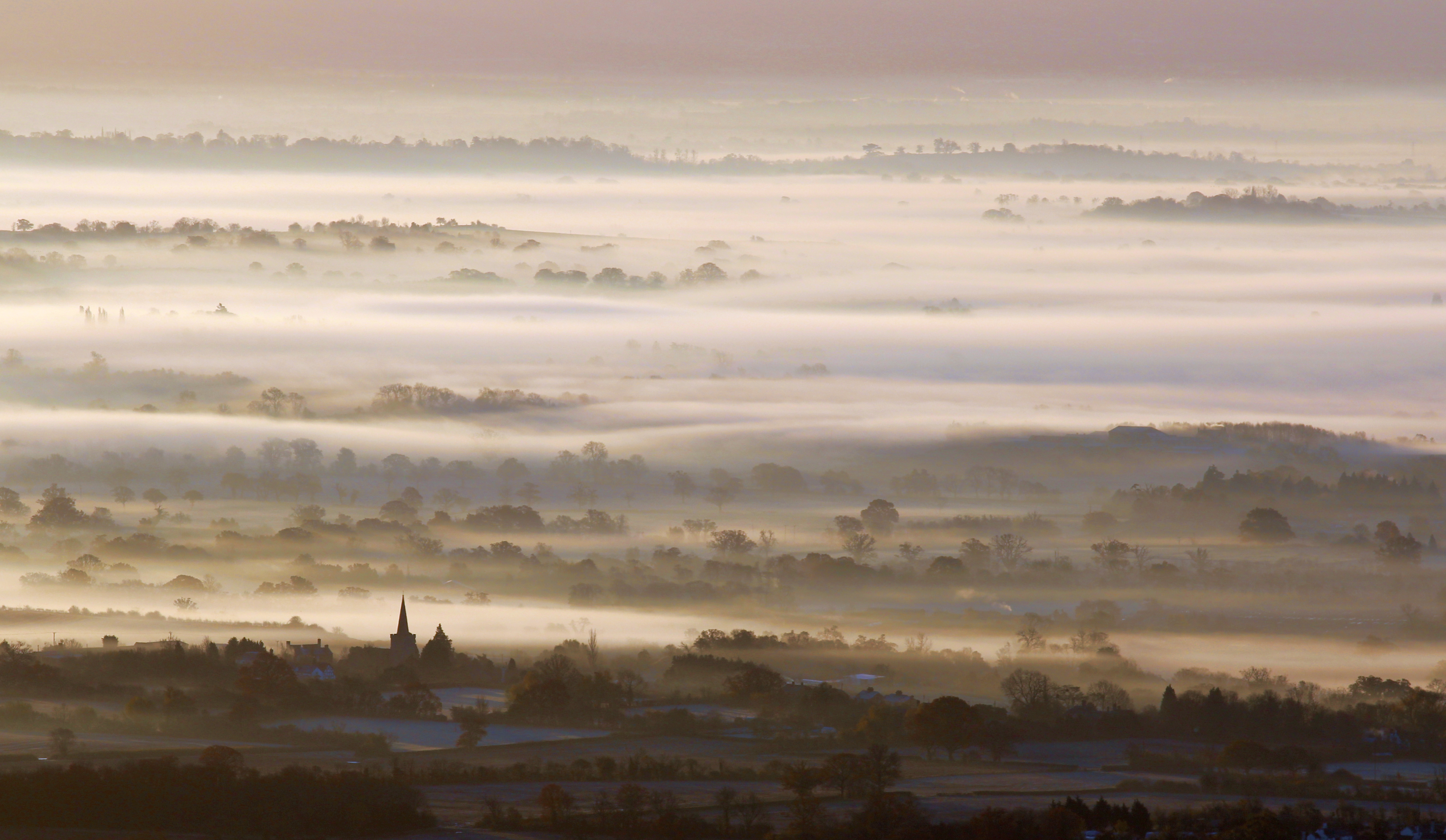 Castlemorton church with mist over Longdon Marsh, © Bob Embleton